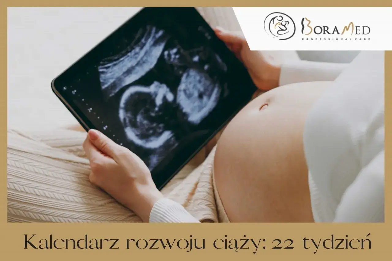 Brzuszek w 22 tygodniu ciąży, który to miesiąc, oglądany na ekranie tabletu z USG.